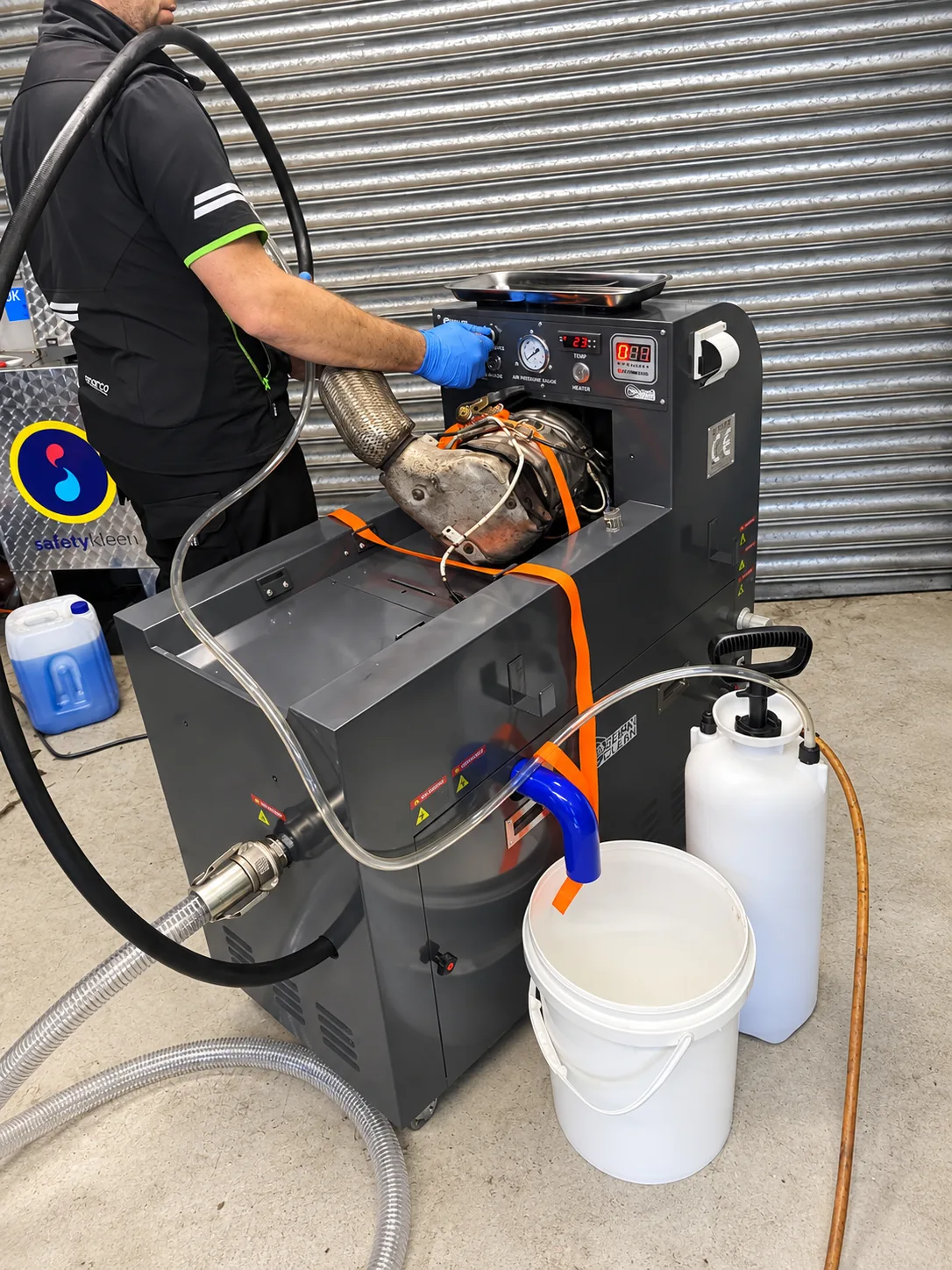 247 Autocentre technician operating specialist diesel particulate filter cleaning equipment in Cwmbran